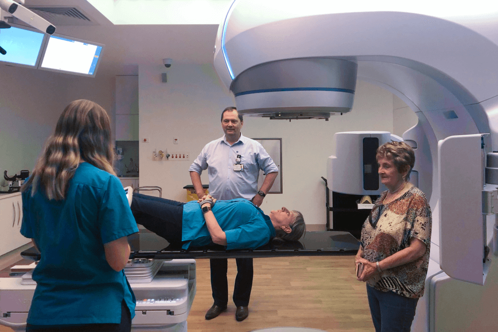 Doctors do a demo of the HyperArc machine to Yvonne